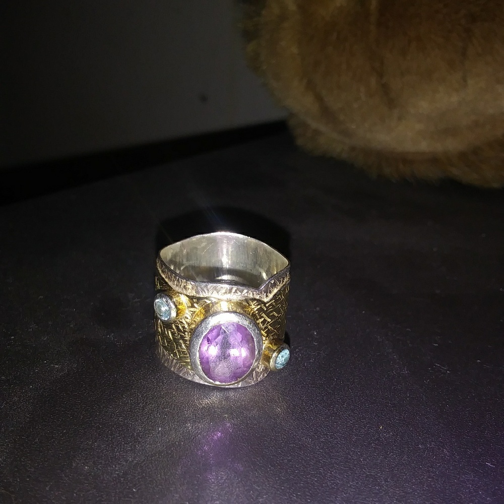 Sterling silver ring with gold accent.